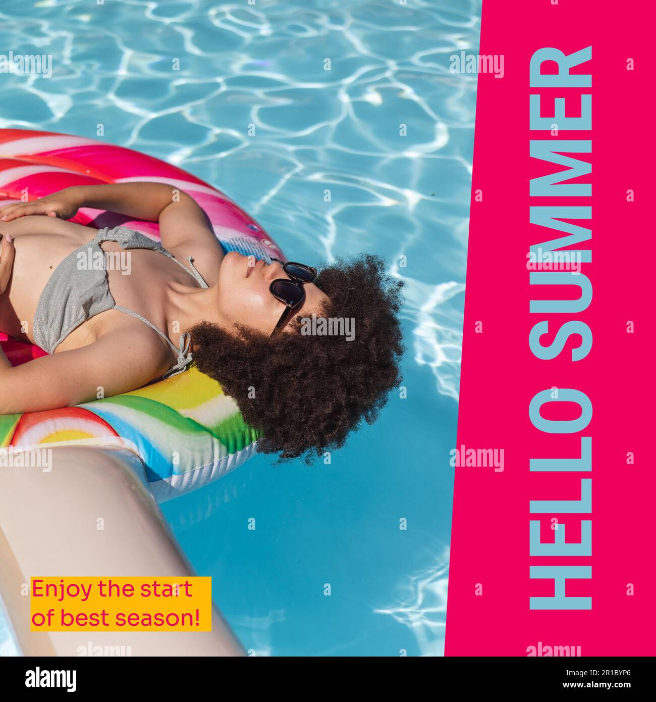 Hello summer text and biracial woman with afro hair relaxing on inflatable swim ring in pool Stock Photo