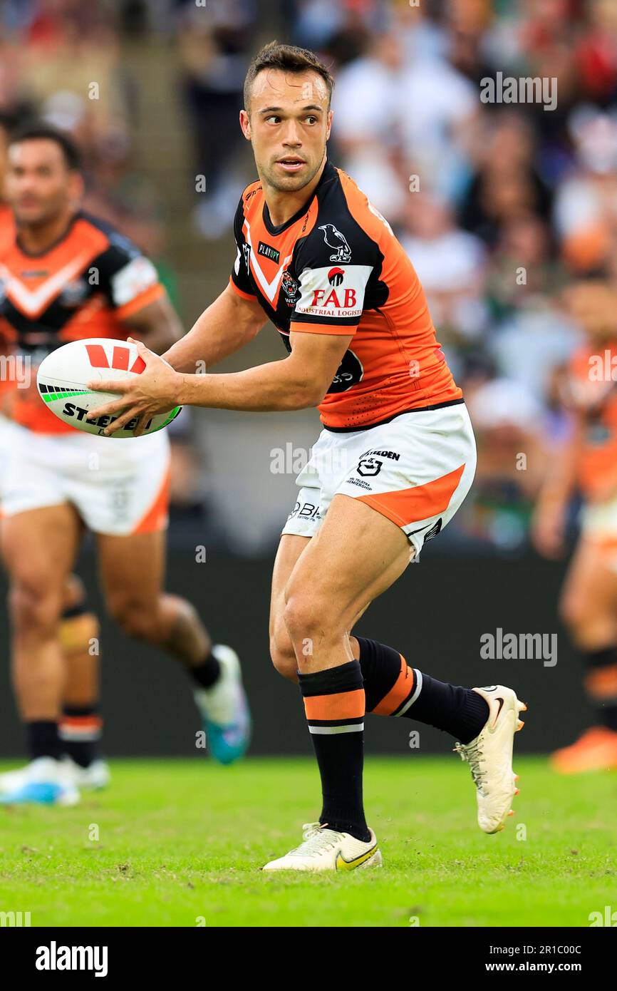 Luke Brooks of the Tigers looks to pass during the NRL Round 11 match ...
