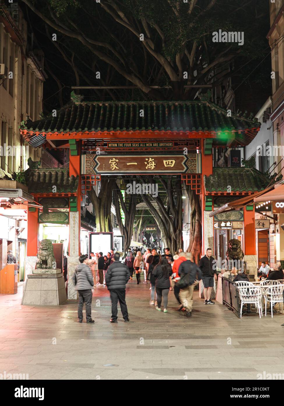 Sydney China Town Entrance at Night with People Walking. Crowded