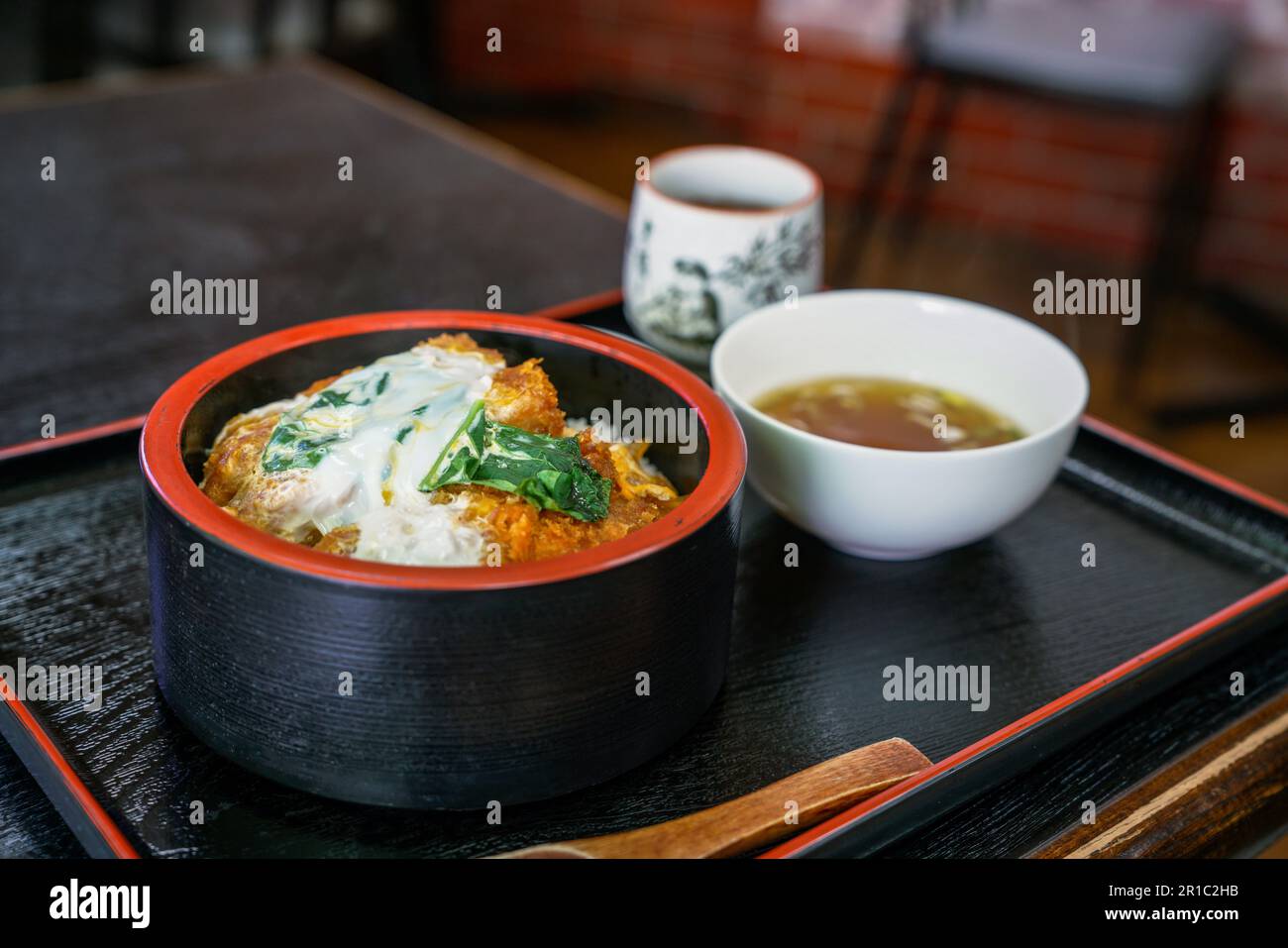 Katsudon is a bowl of rice, with a topping of deepfried pork Stock