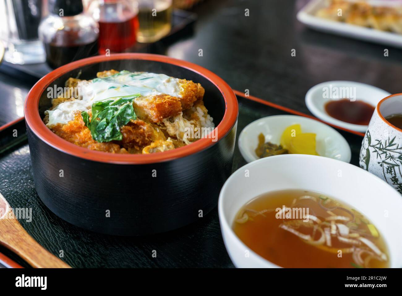 Katsudon is a bowl of rice, with a topping of deepfried pork Stock