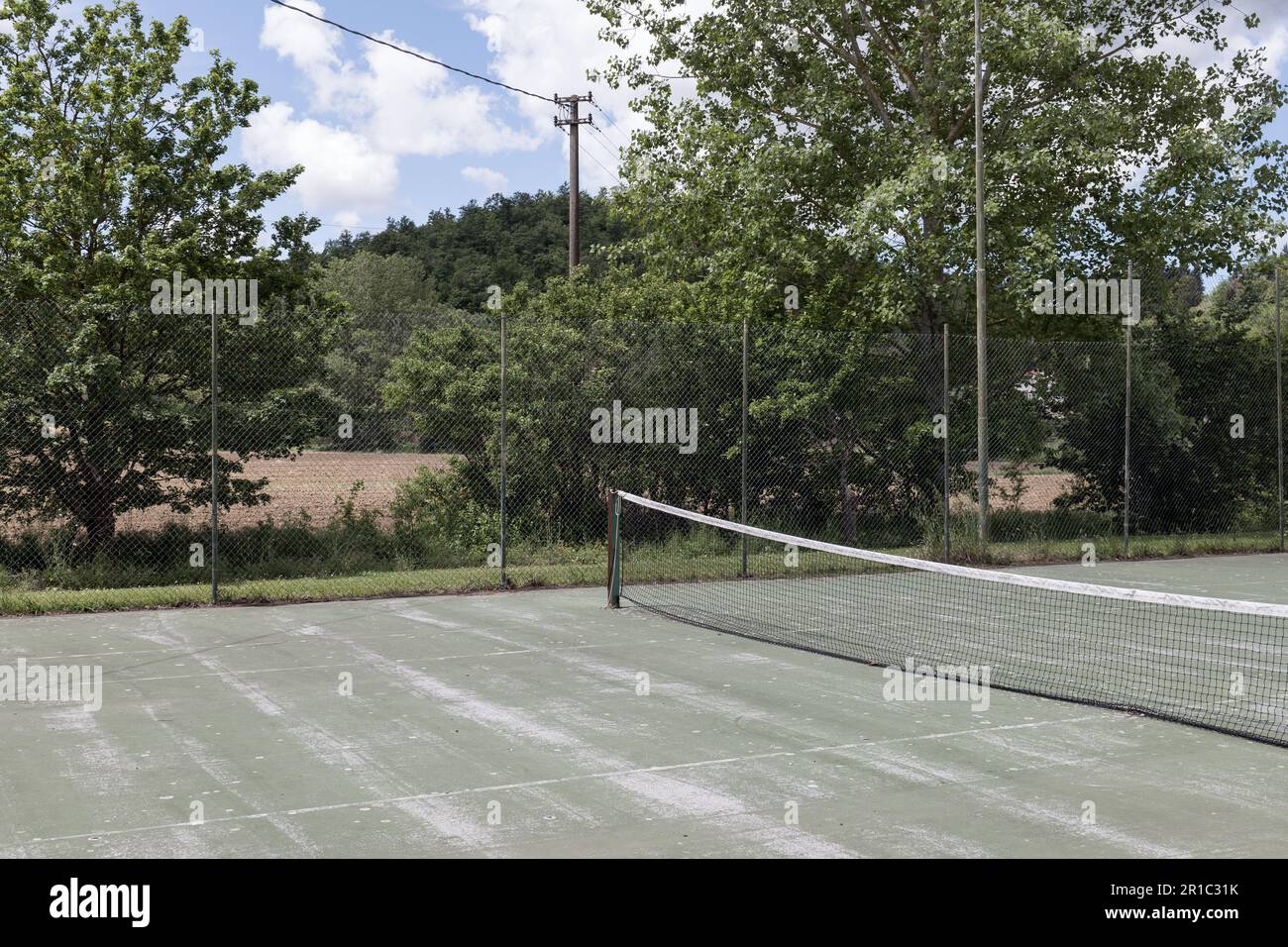 Tennis court during a sunny day in a rural area of Tuscany, Italy Stock  Photo - Alamy