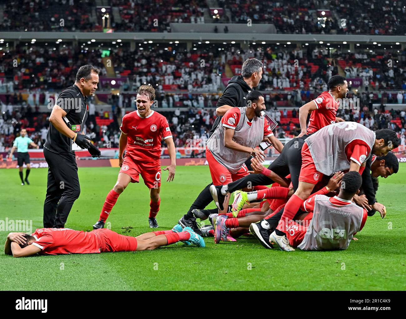 Doha. 12th May, 2023. Al Arabi SC players celebrate after winning the