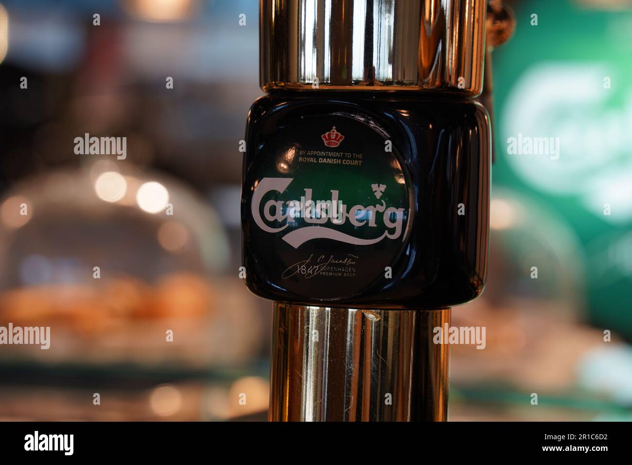 Rhodes, Greece - April 6, 2023:Bar pumps for dispensing draught beer from the metal storage kegs in a pub or bar. Cranes for bottling beer in a bar Stock Photo