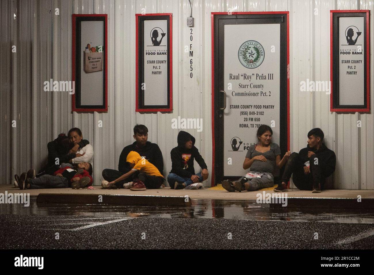 Migrants are processed by immigration officials outside the Starr ...