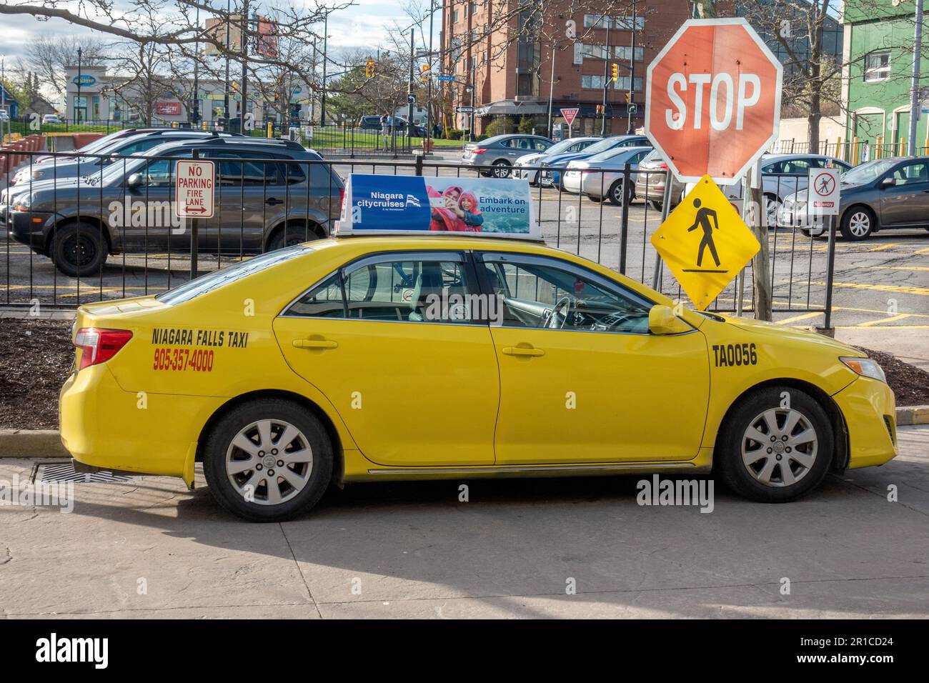 Niagara Falls Ontario Canada Yellow City Taxi Vehicle, Niagara Falls Taxi Parked Waiting For Casino Customers Stock Photo