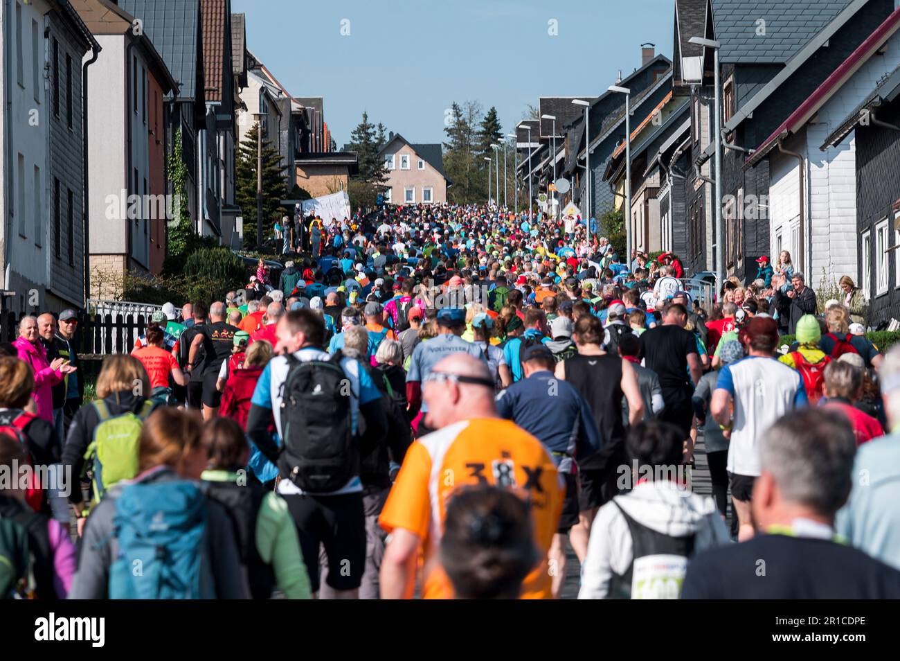 Neuhaus Am Rennweg, Germany. 13th May, 2023. Runners run uphill on a