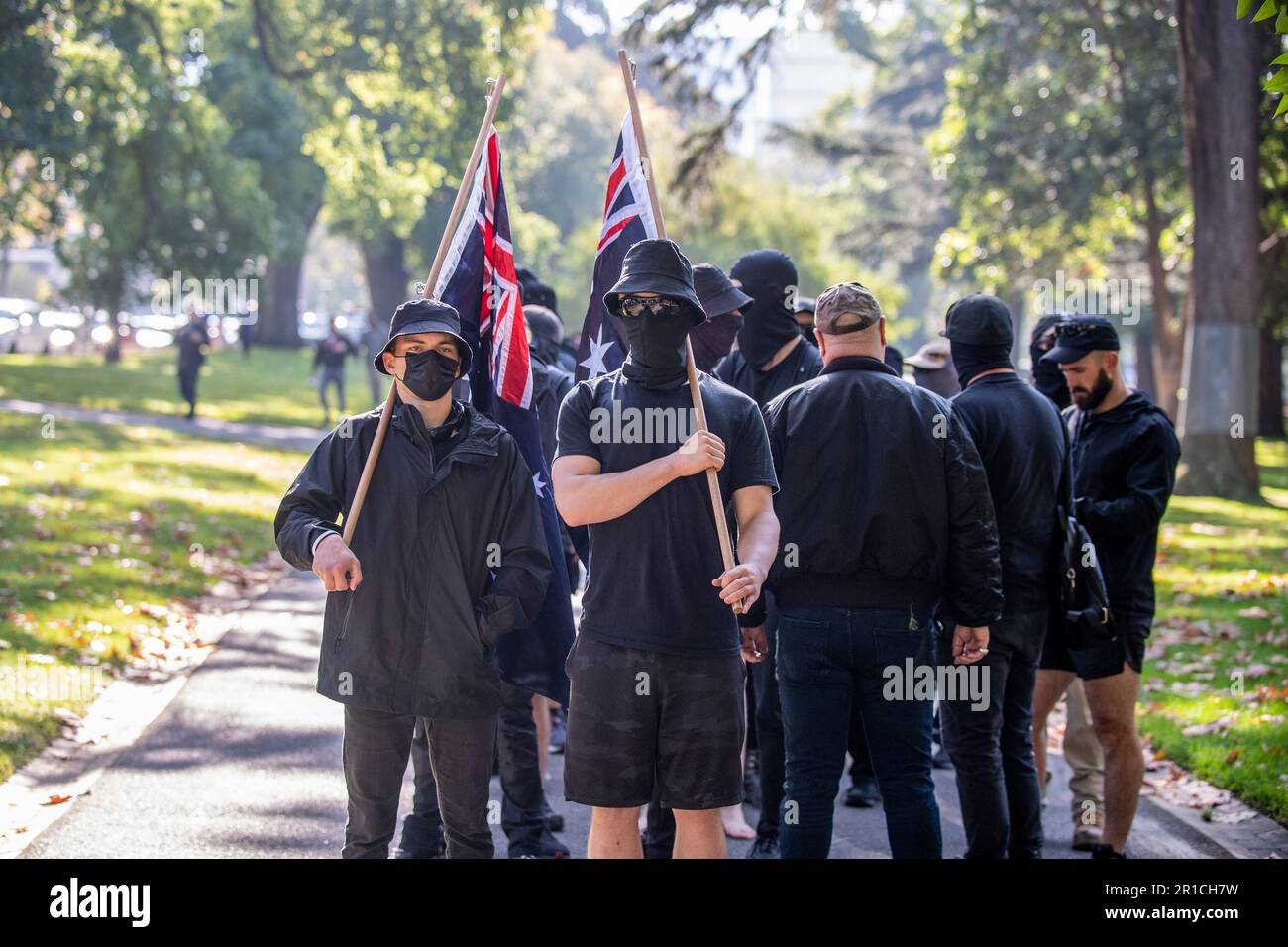 Neo-Nazis stand holding Australian flags during the demonstration. A ...
