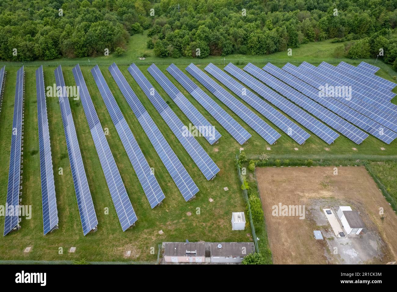 Renewable energy. Aerial shot drones fly over a photovoltaic power station. Group pf solar panels looking the sun for energy production. Stock Photo