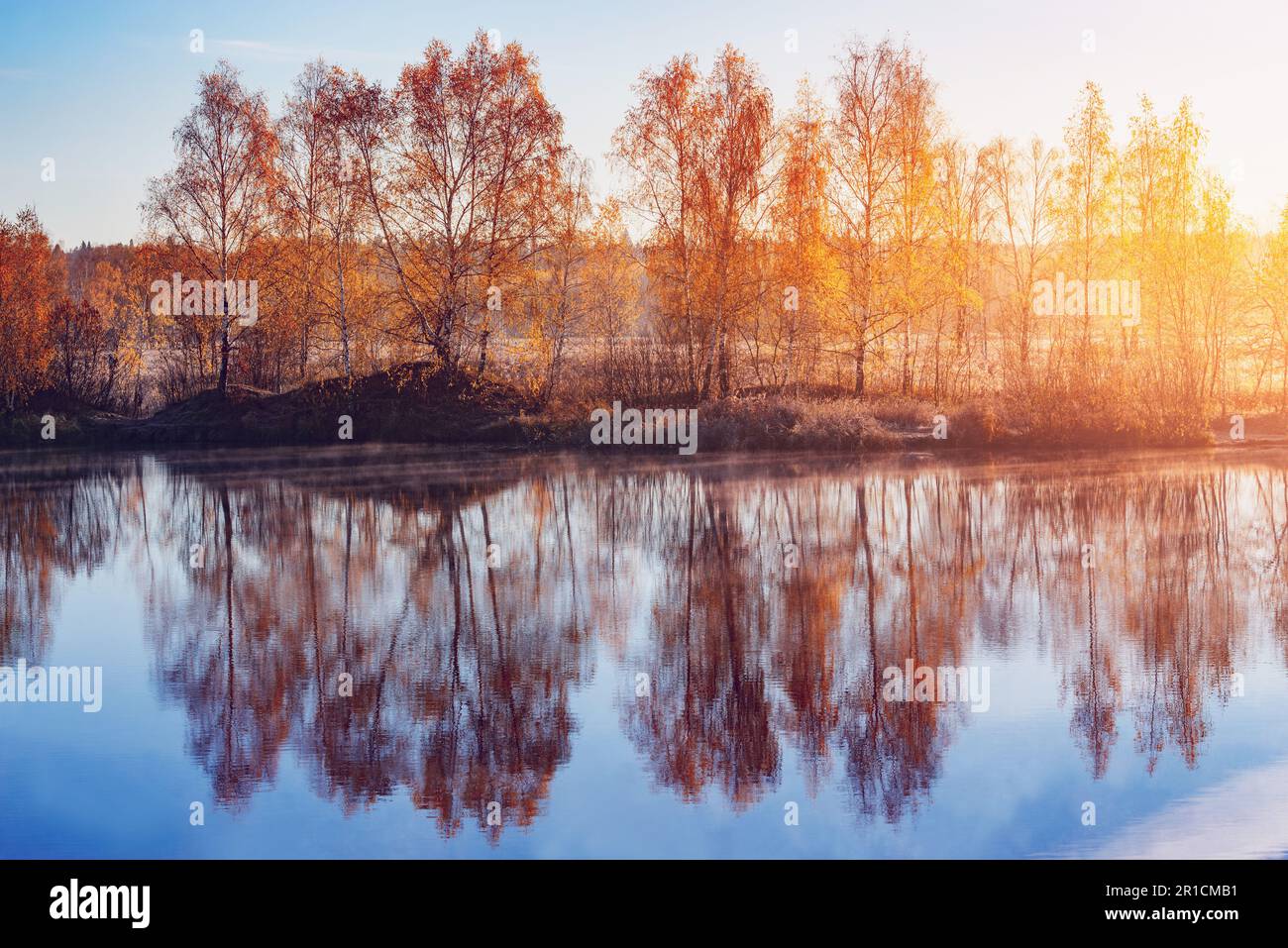 Fog above the lake at cold autumn morning Stock Photo - Alamy