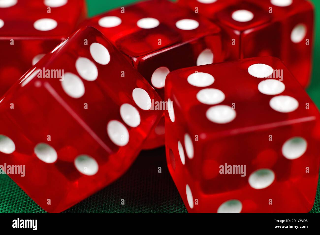 red dice on green table, extra close up Stock Photo
