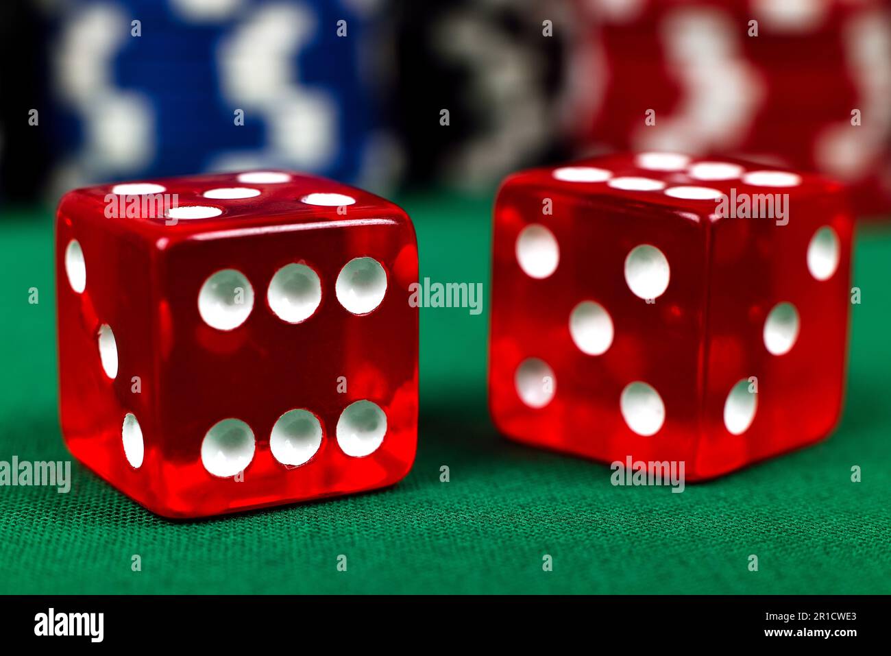 two red dice on green table, close up Stock Photo