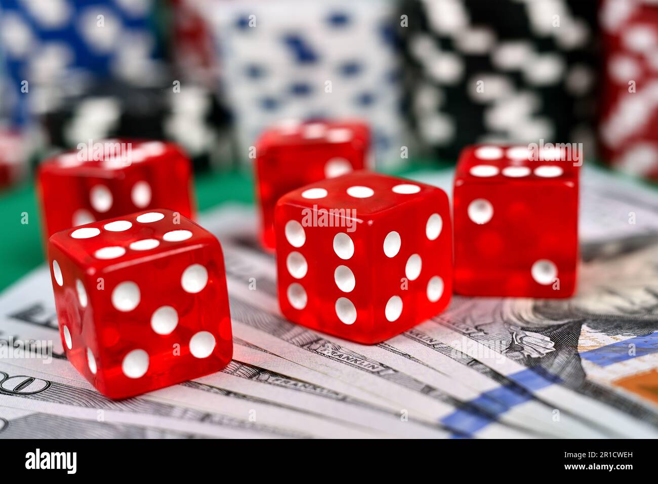 five red dice and dollar bills, poker game concept Stock Photo Alamy