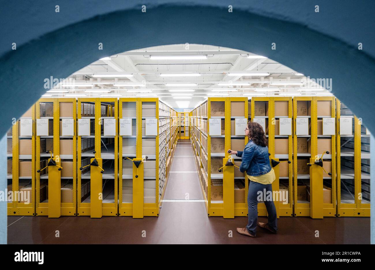 13 May 2023, Saxony, Chemnitz: Archivist Anja Schmaal opens the roll-up ...