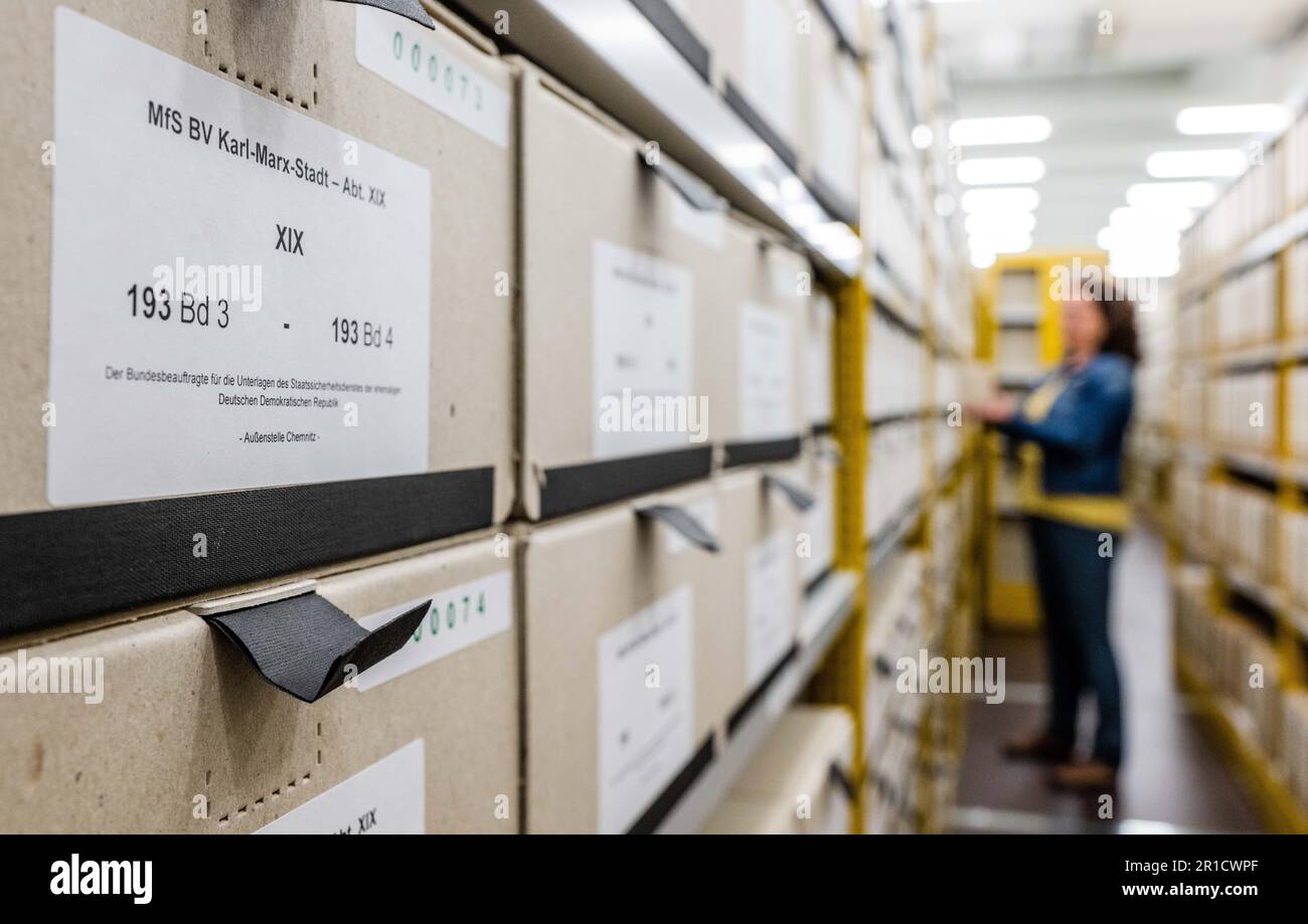 Chemnitz, Germany. 13th May, 2023. View of archive boxes in the storage room of the Bundesarchiv Stasi Unterterlagen-Archiv at the Chemnitz site. The archive has already moved into a former industrial building at the end of 2022. The two-story low-rise building houses two magazine rooms in which around seven kilometers of documents, approximately 2.3 million index cards and over 71000 photographic documents are stored. Since 1992, Chemnitz has received 329932 requests for personal file inspection; in 2022, the number was 1361. Credit: Kristin Schmidt/dpa/Alamy Live News Stock Photo