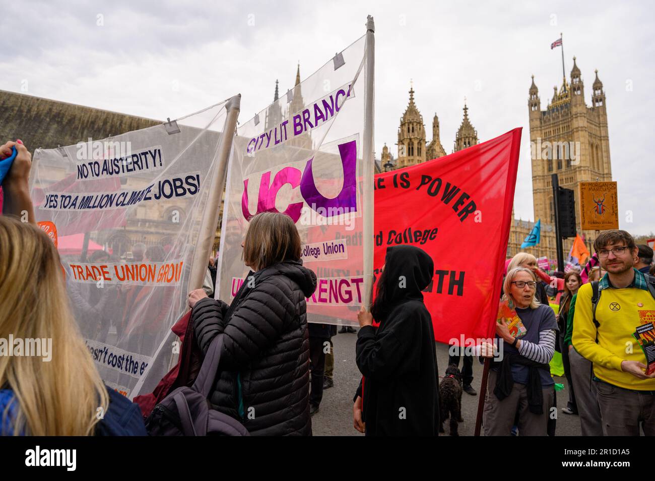 LONDON - April 22, 2023: Witness XR protesters carrying banners near Parliament, advocating for social and environmental justice, in a powerful displa Stock Photo