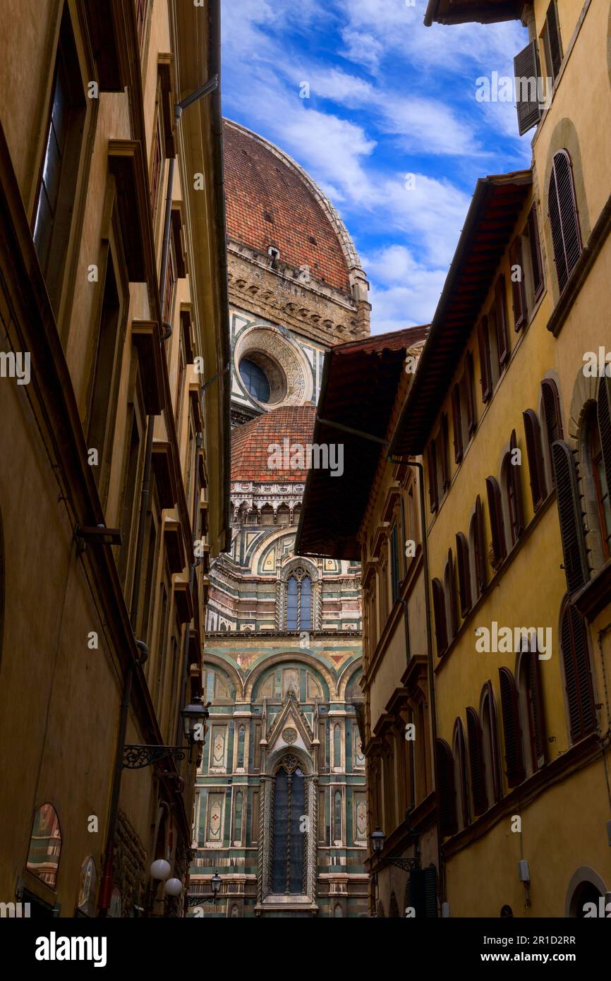 Street view of Florence: glimpse of Brunelleschi's Dome. Stock Photo