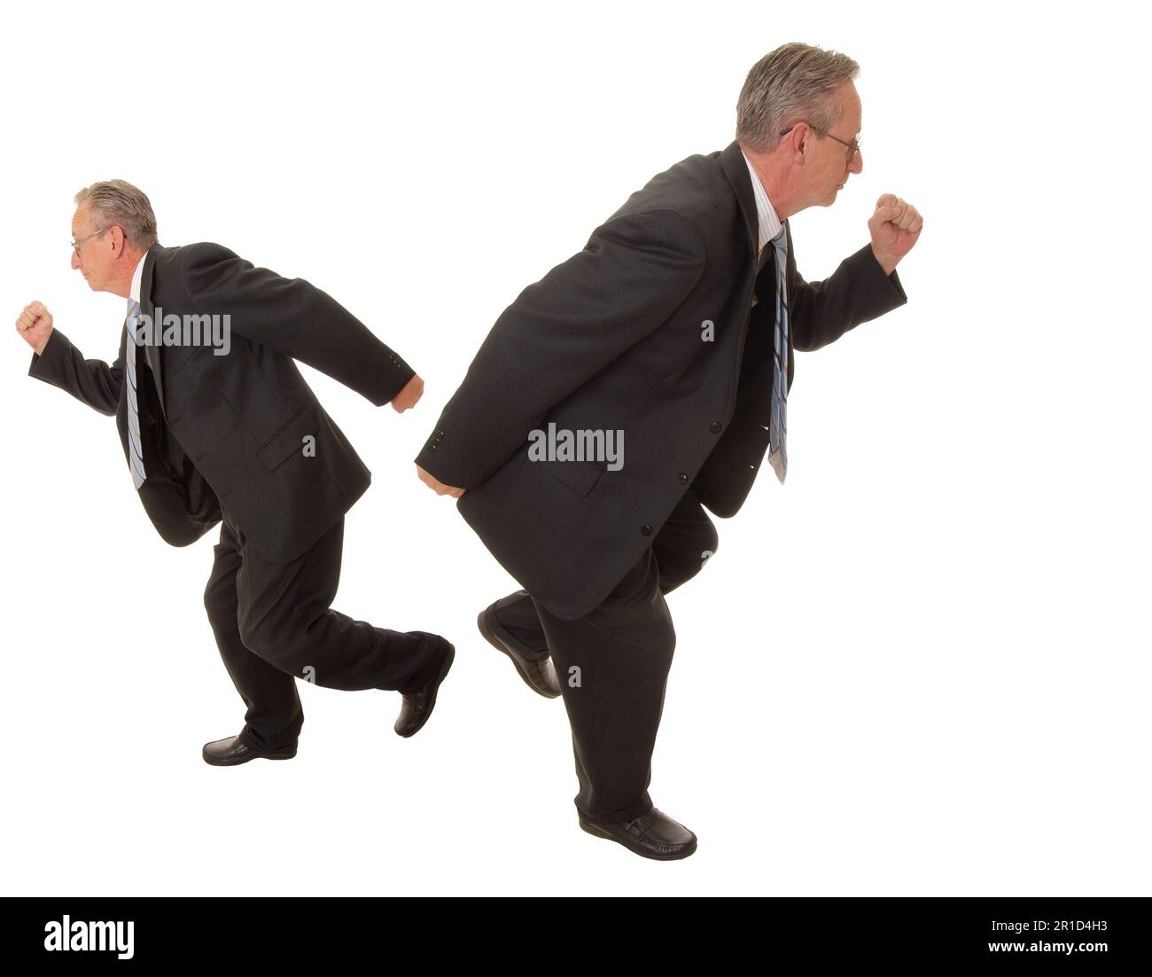 Senior businessman going in two different directions at the same time Stock Photo