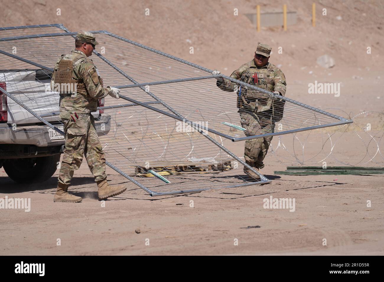 El Paso, United States. 11th May, 2023. Texas Army National Guard soldiers with the governors self-styled Texas Tactical Border Force, assemble fence panels along the border with Mexico as part of Operation Lone Star Task Force West, May 11, 2023 near El Paso, Texas. The fear over a migrant surge after Title 42 expired failed to materialize with fewer migrants risking the tougher penalties under the new Title 8 rules. Credit: Mark Otte/Texas National Guard/Alamy Live News Stock Photo