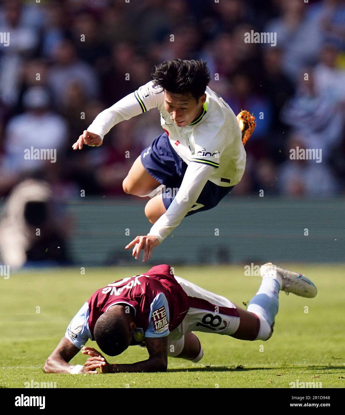 Tottenham Hotspur's Son Heung-min goes down under the challenge from Aston Villa's Ashley Young during the Premier League match at Villa Park, Birmingham. Picture date: Saturday May 13, 2023. Stock Photo