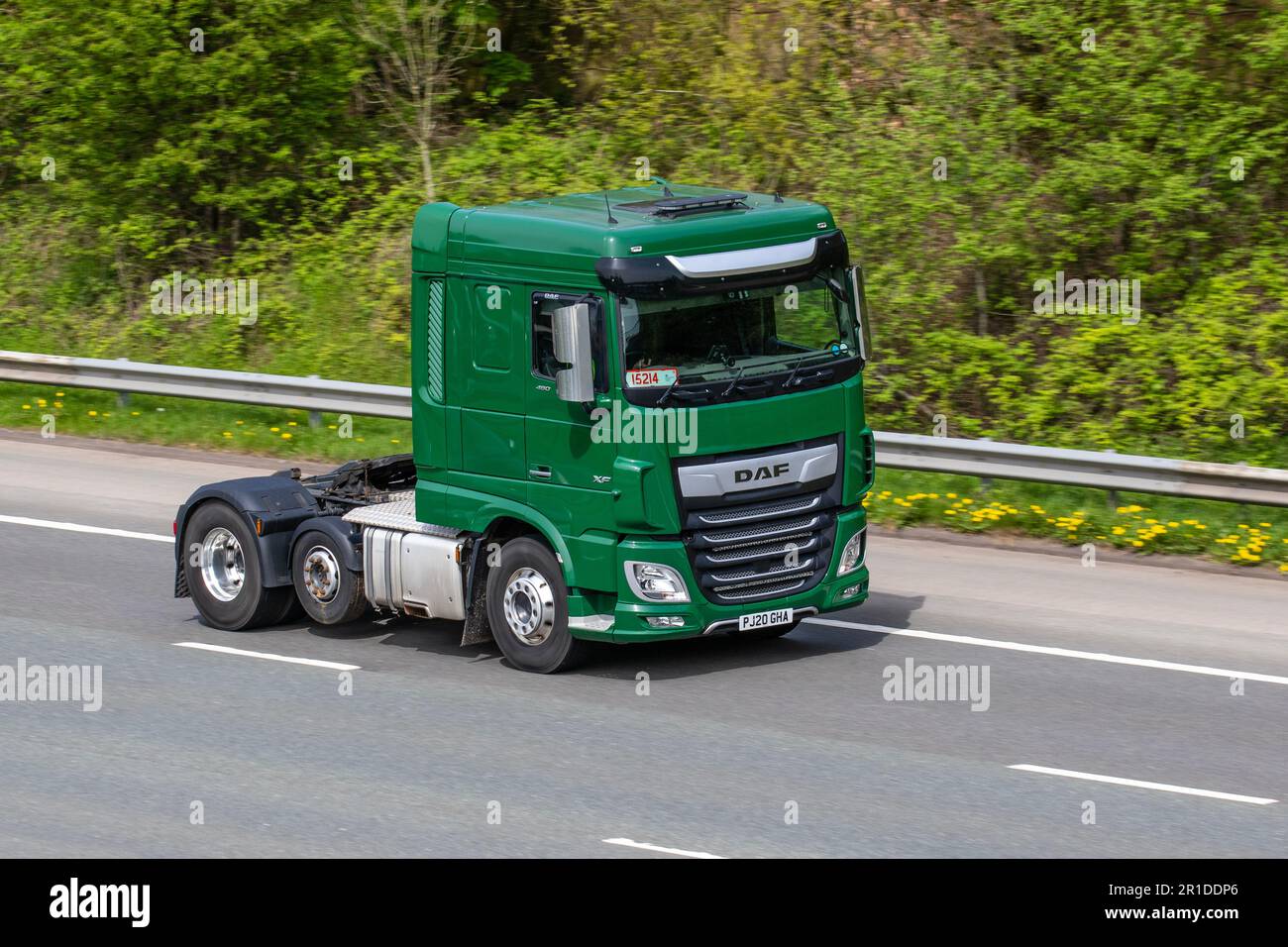 2020 Green DAF XF 12902cc Diesel TractorUnit travelling on the M61 motorway UK Stock Photo