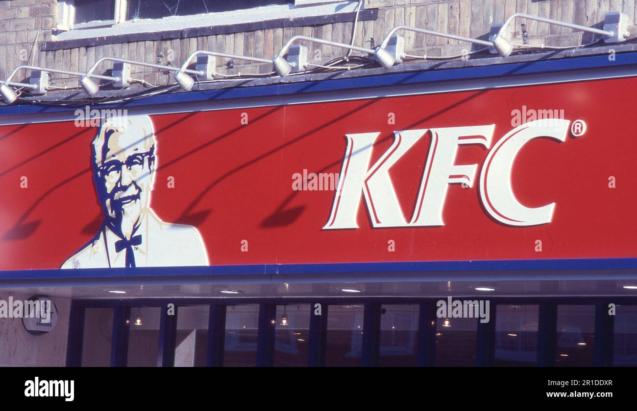 Signage outside a branch of the Kentuck Fried Chicken chain at Ashford in Kent, England on July 1, 2005. The first KFC franchise opened in 1952 in Utah, USA. Stock Photo