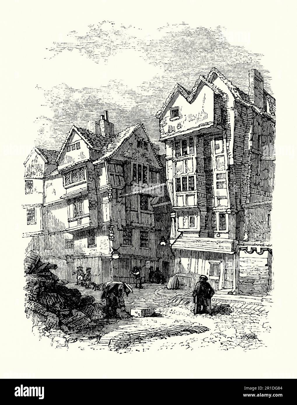 An old engraving of old timbered houses in Butchers Row, Strand, London, England, UK c. 1600. Poor quality housing in close proximity to each other in narrow lanes led to unsanitary conditions and helped the spread of disease – here rubbish is piled up in the street (left). Overhanging upper stories (a jetty or jetties) meant the houses were really close to those across the street. Note the horizontal wooded props used to stabilise the buildings and help prevent collapse. Stock Photo