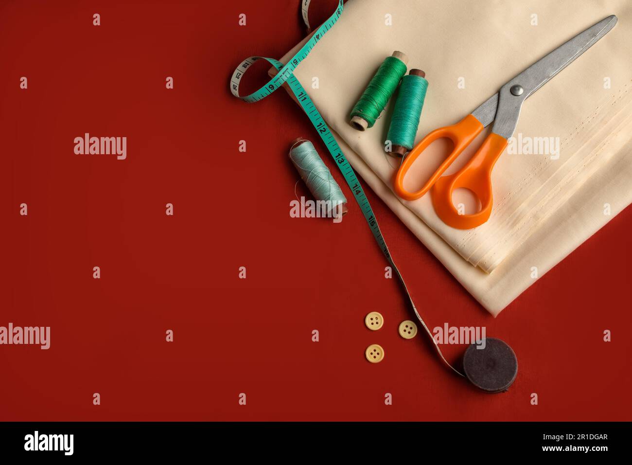 Top view aerial image of a tailor's work desk in a sewing on a