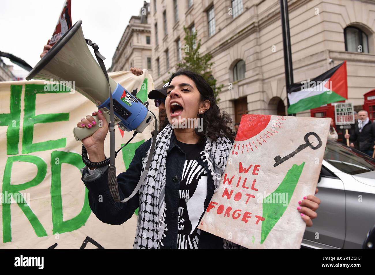 May 13, 2023, London, England, United Kingdom: A demonstrator shouts slogans through a megaphone, at the rally in central London. Palestinians commemorate the 75th anniversary of Nakba Day, also known as the Palestinian Catastrophe, which involved the destruction of Palestinian society in 1948, as well as the continuing displacement of many Palestinian people from their homeland. (Credit Image: © Thomas Krych/ZUMA Press Wire) EDITORIAL USAGE ONLY! Not for Commercial USAGE! Stock Photo