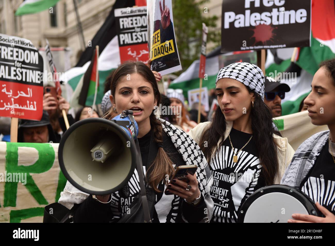 London, England, UK. 13th May, 2023. Demonstrator shouts slogans through a megaphone, at the rally in central London. Palestinians commemorate the 75th anniversary of Nakba Day, also known as the Palestinian Catastrophe, which involved the destruction of Palestinian society in 1948, as well as the continuing displacement of many Palestinian people from their homeland. (Credit Image: © Thomas Krych/ZUMA Press Wire) EDITORIAL USAGE ONLY! Not for Commercial USAGE! Stock Photo