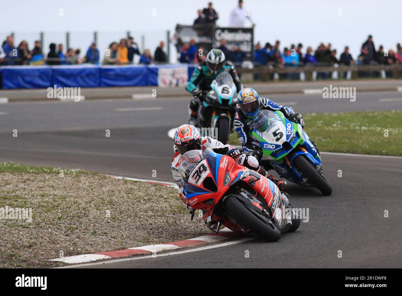 Antrim, Northern Ireland, UK. 13th May 2023: fonaCAB Nicholl OilsNorth West 200, Portrush, Antrim, Northern Ireland: North West 200 Race Day 2023: Alastair Seeley (BMW - Milwaukee BMW Motorrad) takes second place in the feature NW200 SuperBike race, ahead of Dean Harrison (Kawasaki - DAO Racing) in third and Michael Dunlop (Honda - Carl Cox Motorsport by Hawk Racing) in fourth Credit: Action Plus Sports Images/Alamy Live News Stock Photo