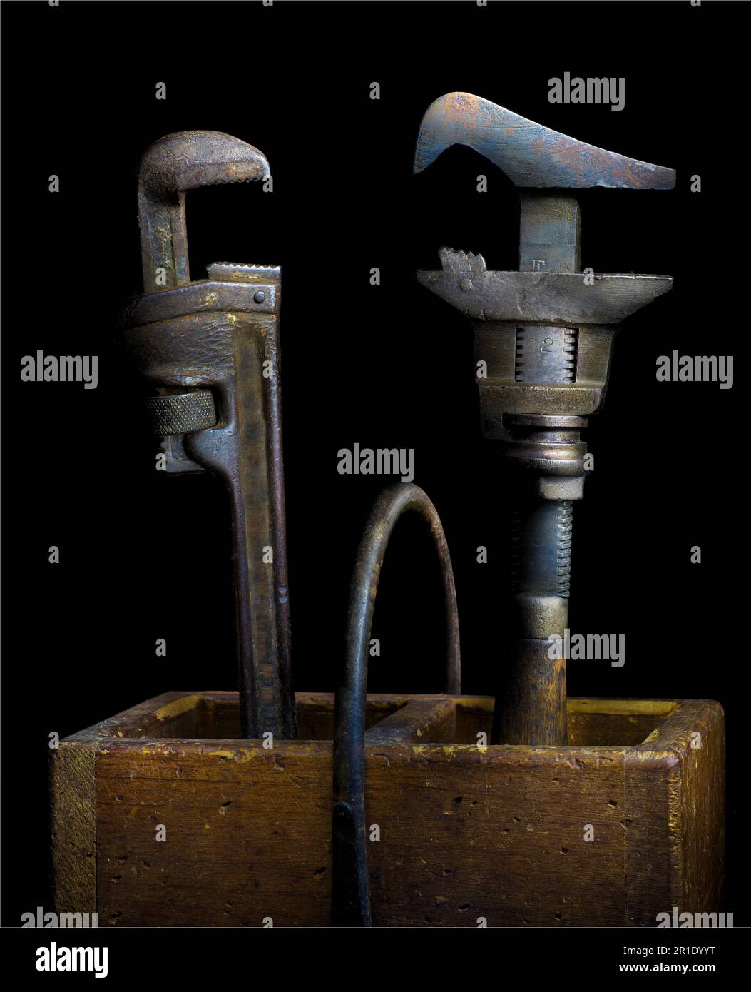 Two pipe wrenches posed as if in an arguement. Title: 'A wrenching conversation.' Stock Photo