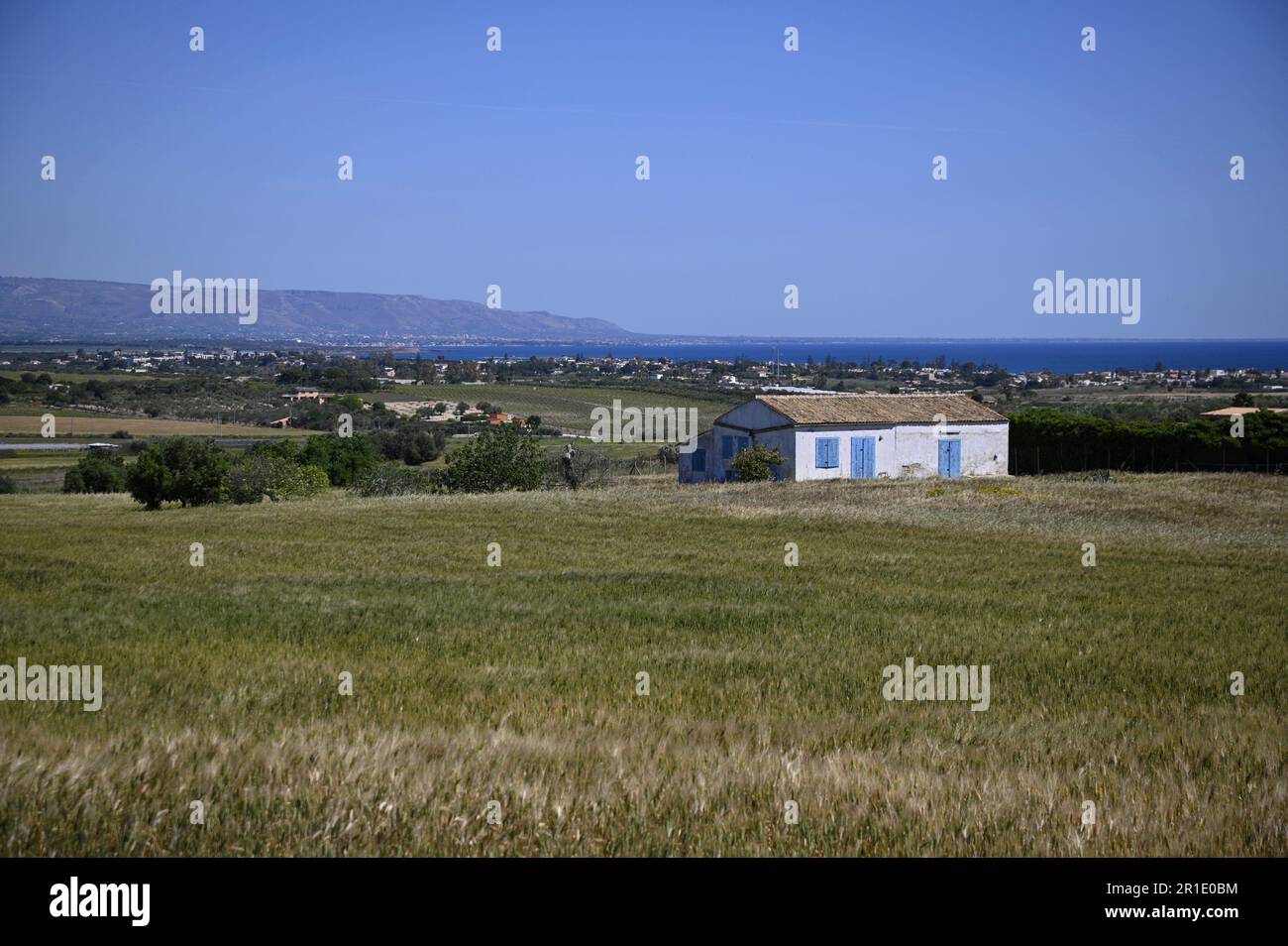 Rural landscape with scenic view of a traditional farmhouse overlooking ...