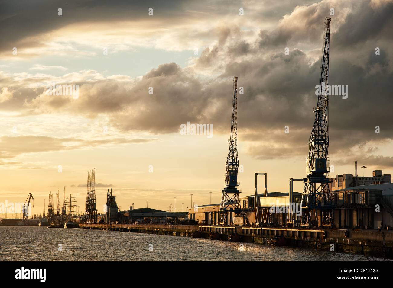 SOUTHAMPTON, HAMPSHIRE, UK - APRIL 26, 2009: Southampton Western Docks at Sunset with dramatic clouds Stock Photo