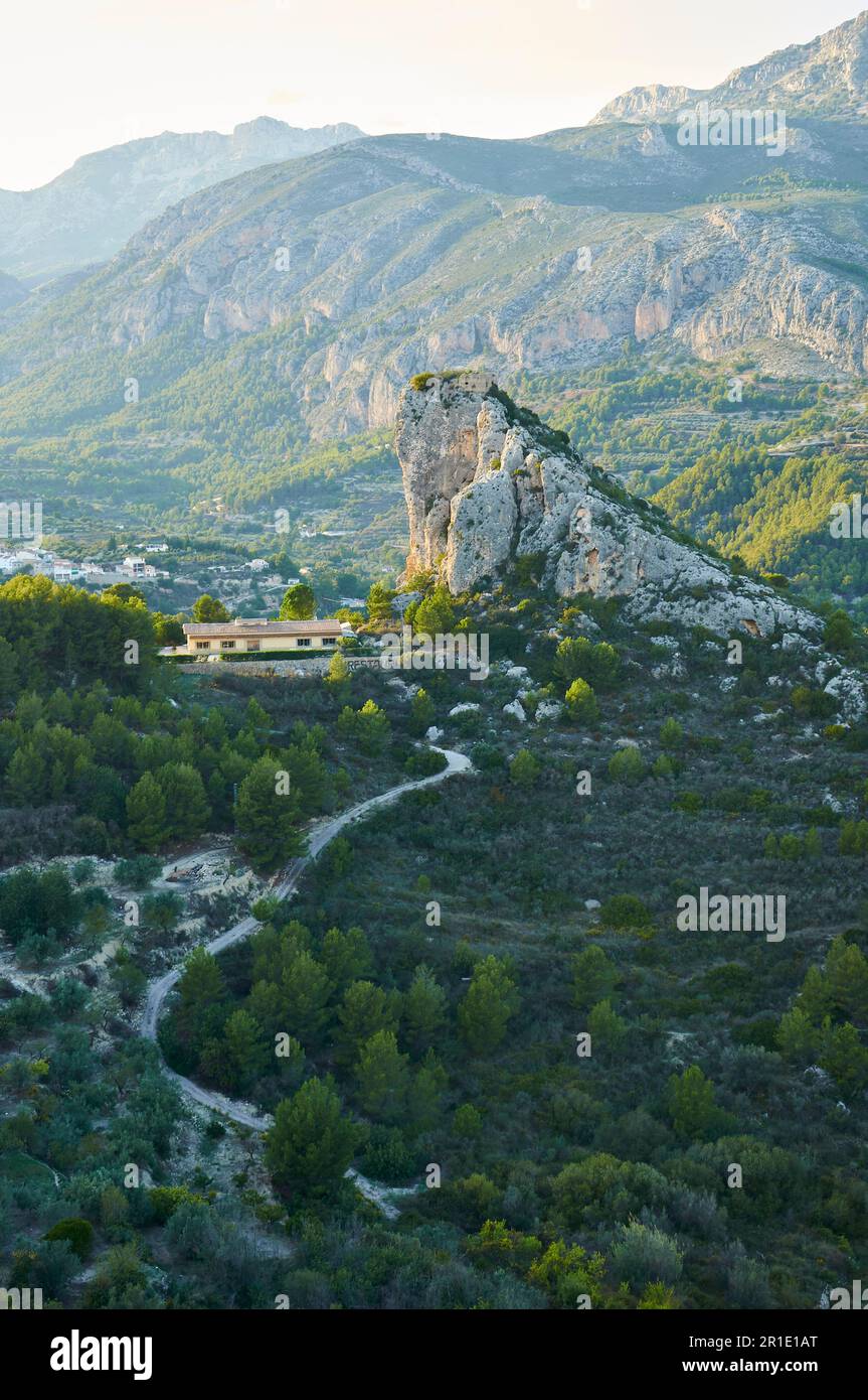 Scenic view of Vall de Guadalest with Penya del Castellet and Beniardá town (Castell de Guadalest, Marina Baixa, Alicante, Valencian Community, Spain) Stock Photo