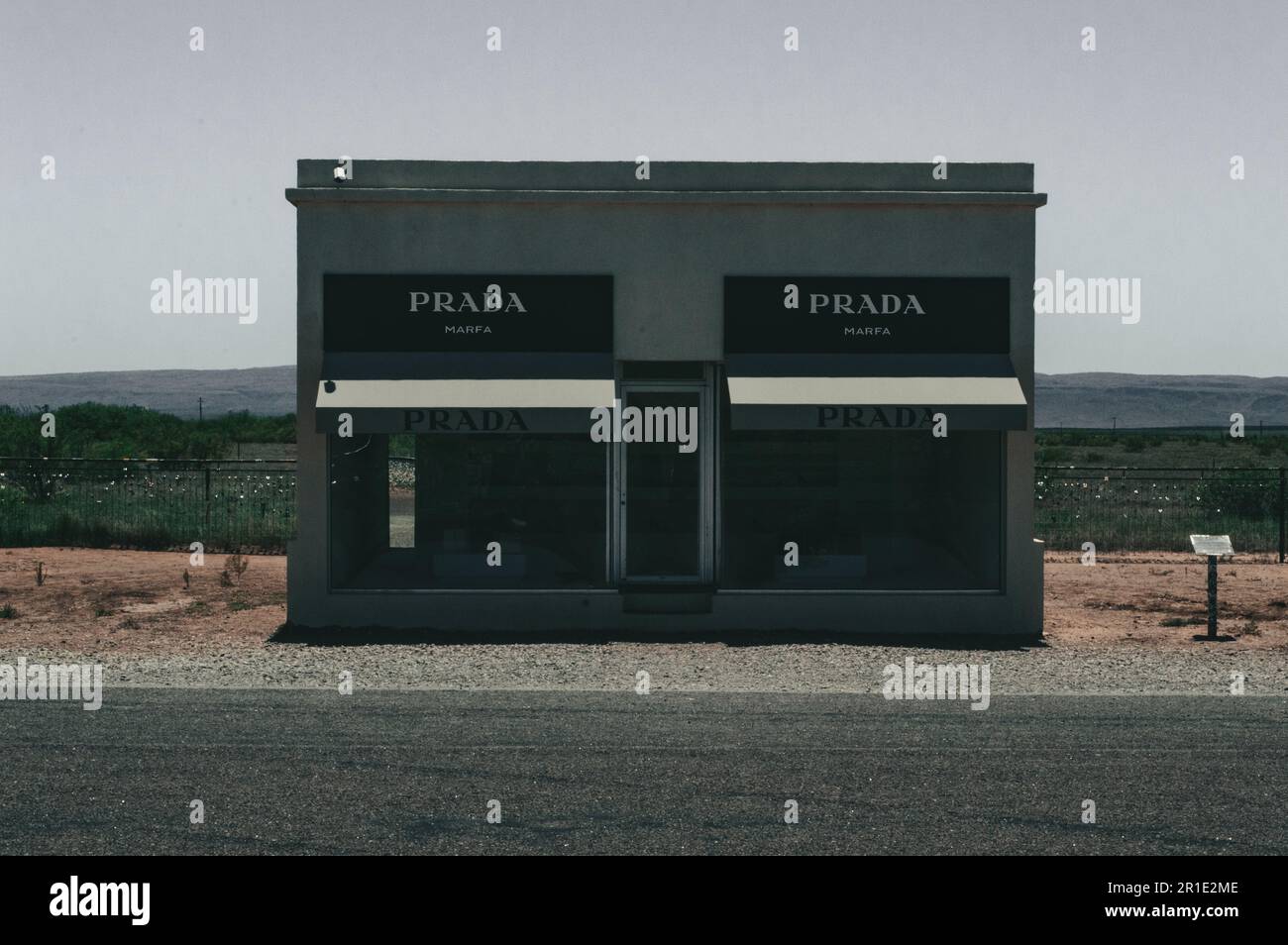 A small PRADA building with glass exteriors on an urban street in Marfa