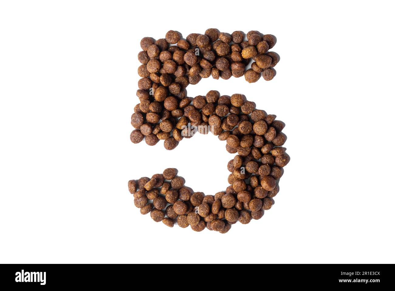 Number 5 made from dry pet food on a white background. Design, layout. Dietary therapeutic nutrition for dogs and cats. Favorite food for animals. Car Stock Photo