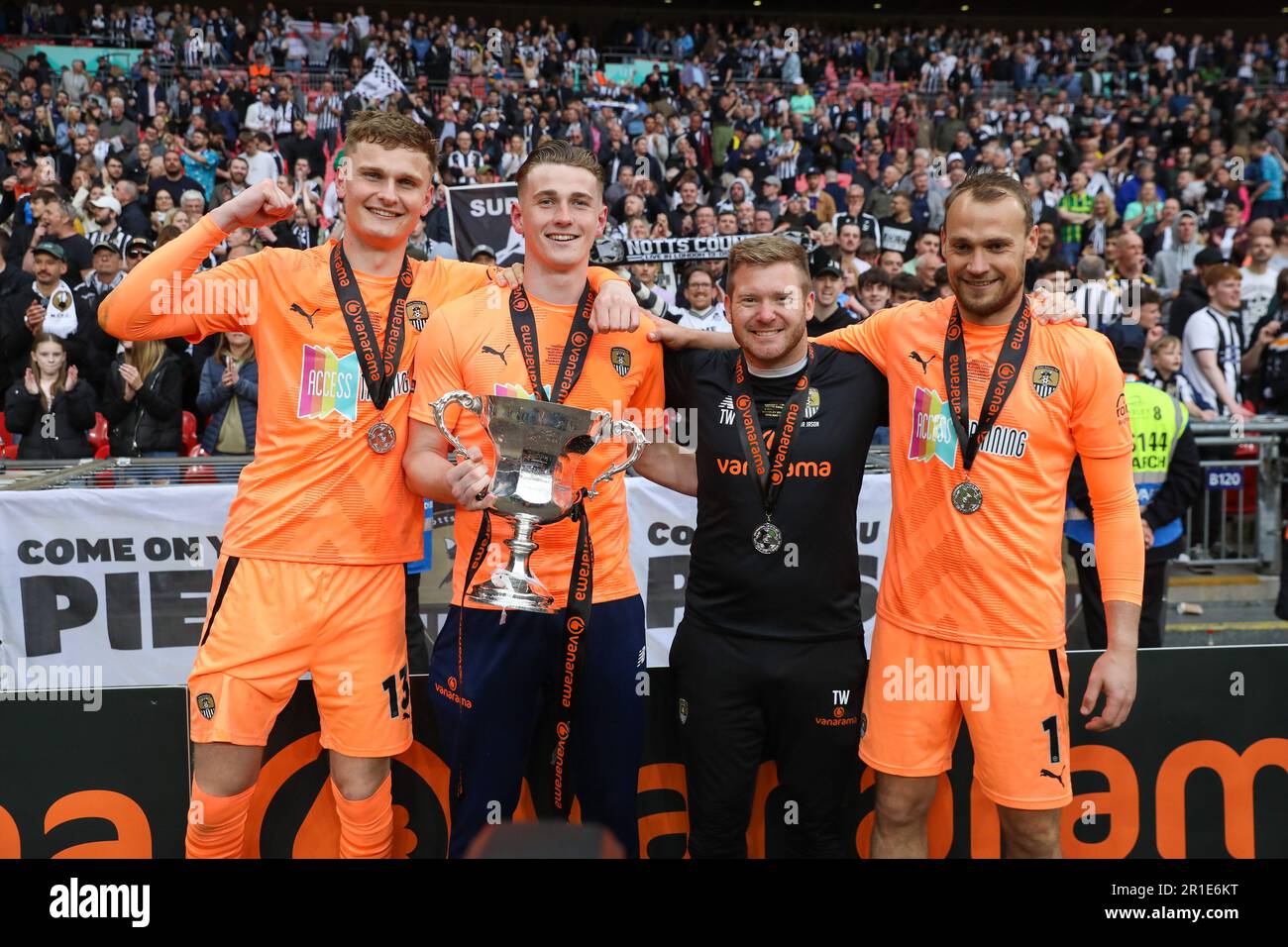 London, UK. 13th May, 2023. London, England, May 13th 2023: Sam Slocombe (1 Notts County), Tiernan Brooks (12 Notts County), Archie Mair (13 Notts County) and member of Notts County's coaching staff poses with the trophy during the Vanarama National League Promotion Final match between Chesterfield and Notts County at Wembley Stadium in London, England. (Alexander Canillas/SPP) Credit: SPP Sport Press Photo. /Alamy Live News Stock Photo