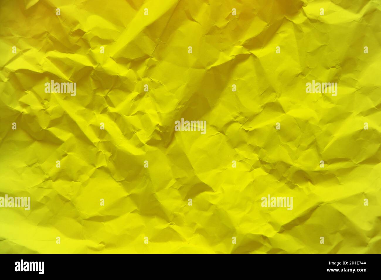yellow crumpled paper as a background Stock Photo