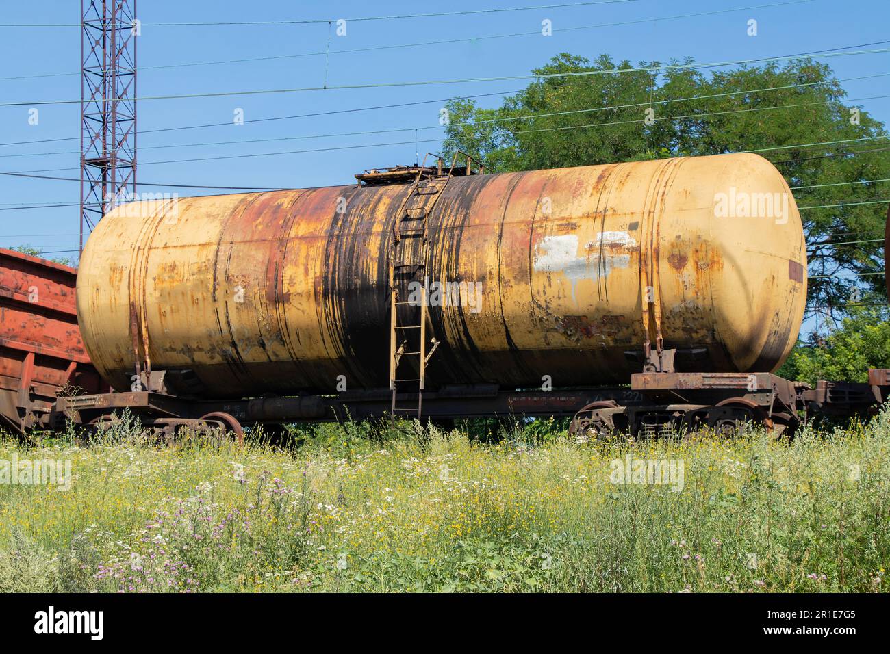 old tank for oil transportation stands on the railway