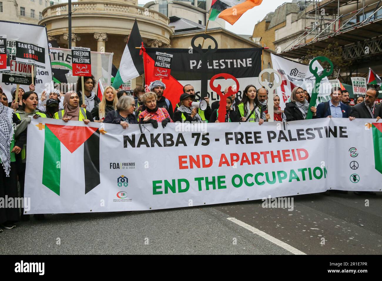London, UK. 13th May, 2023. Palestinians and supporters hold a large banner during a march and rally in central London to commemorate the 75th anniversary of the Nakba day, also known as the Palestinian Catastrophe. Nakba was the process of, what they consider to be, 'ethnic cleansing, colonisation and dispossession which saw over 750,000 Palestinians driven into exile. (Photo by Steve Taylor/SOPA Images/Sipa USA) Credit: Sipa USA/Alamy Live News Stock Photo