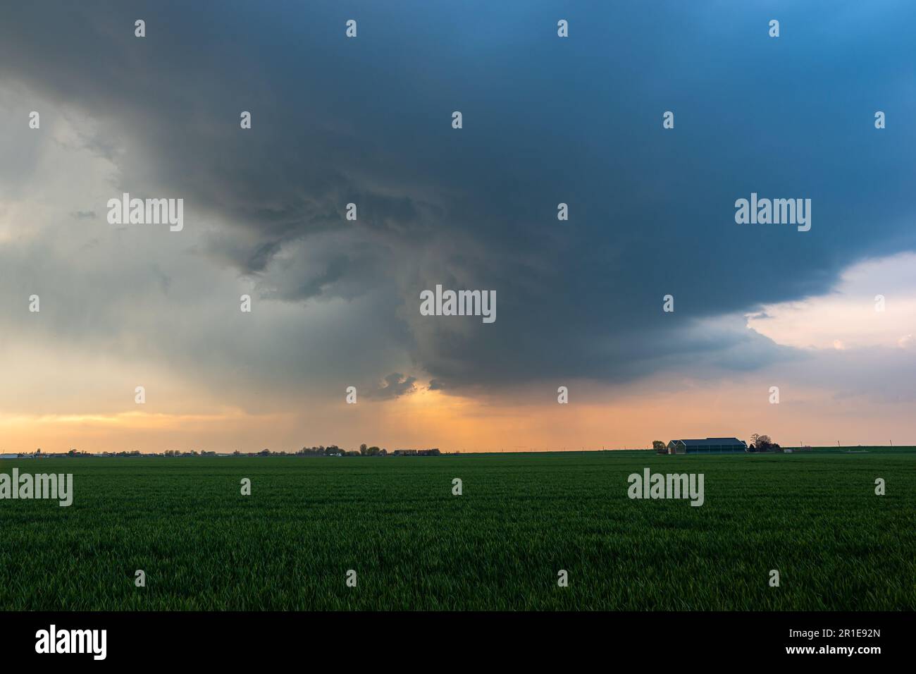 View of a thunderstorm over the plains in the evening light Stock Photo