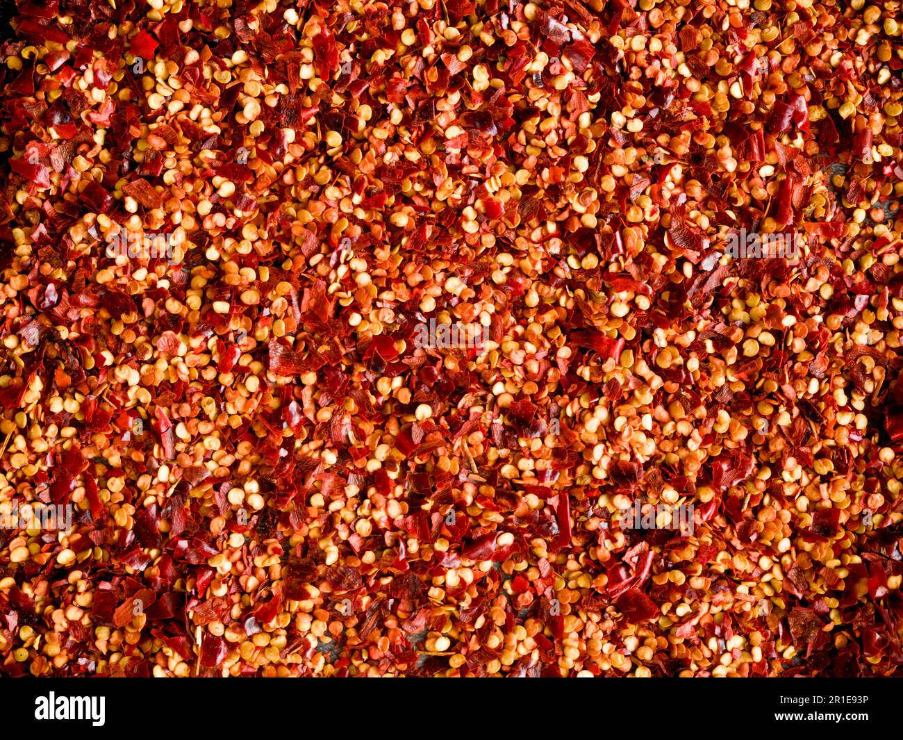 Crushed red chilli pepper used as background. Cayenne pepper, dried