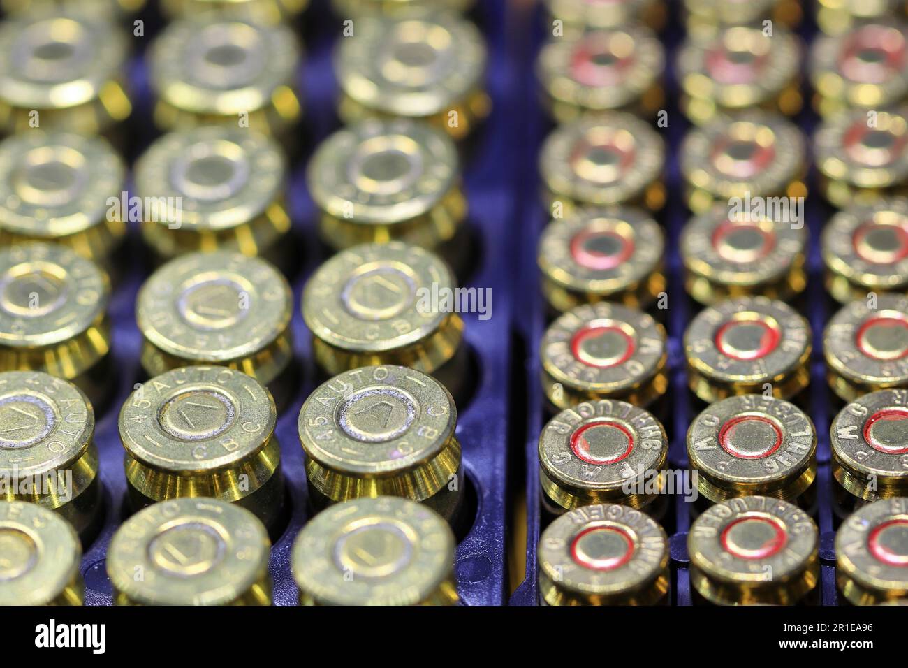 Row of Rim and primer of .45 or 11mm and 9mm para cartridges. Stock Photo