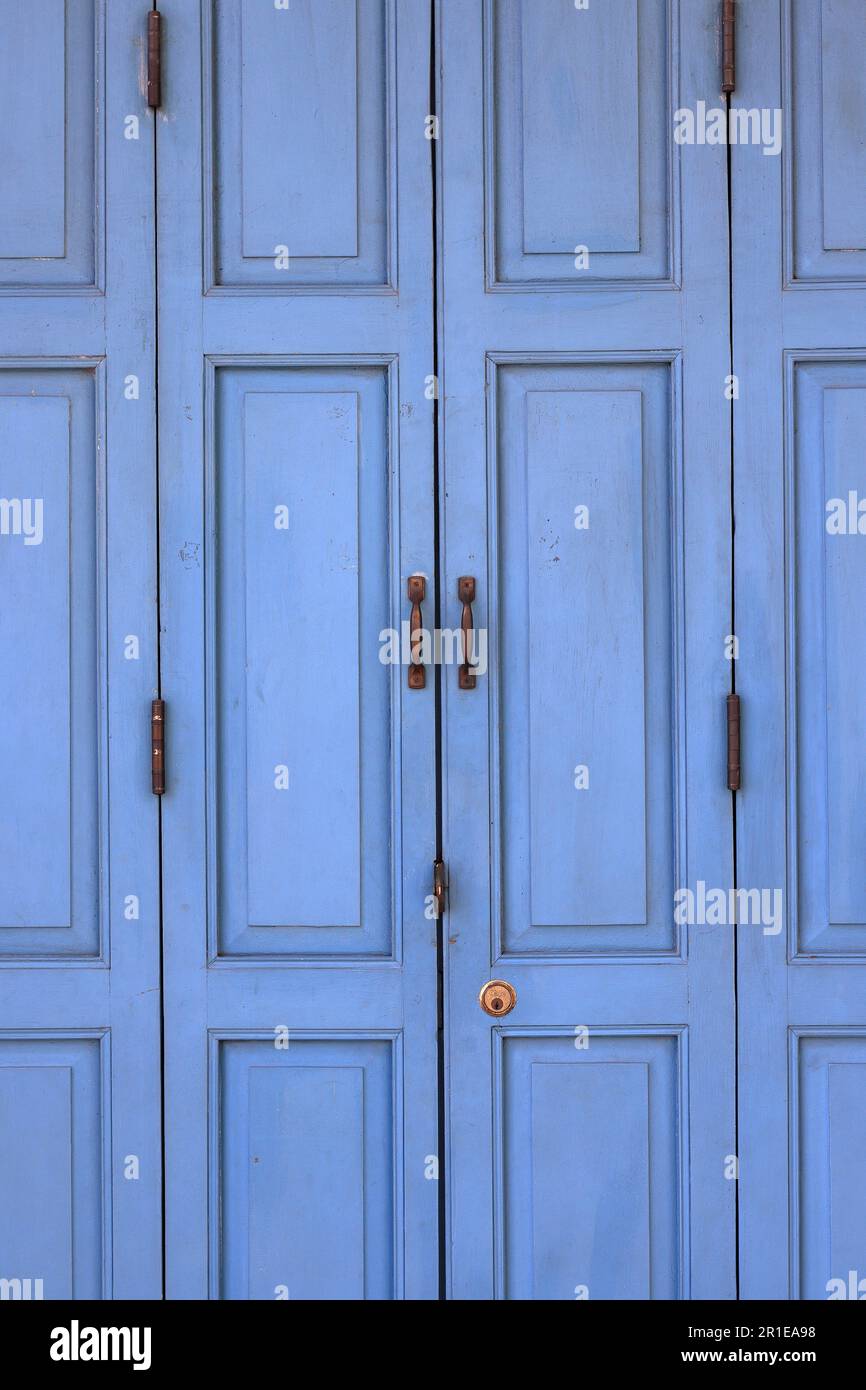 traditional old Blue Painted Wooden Folding door. Stock Photo