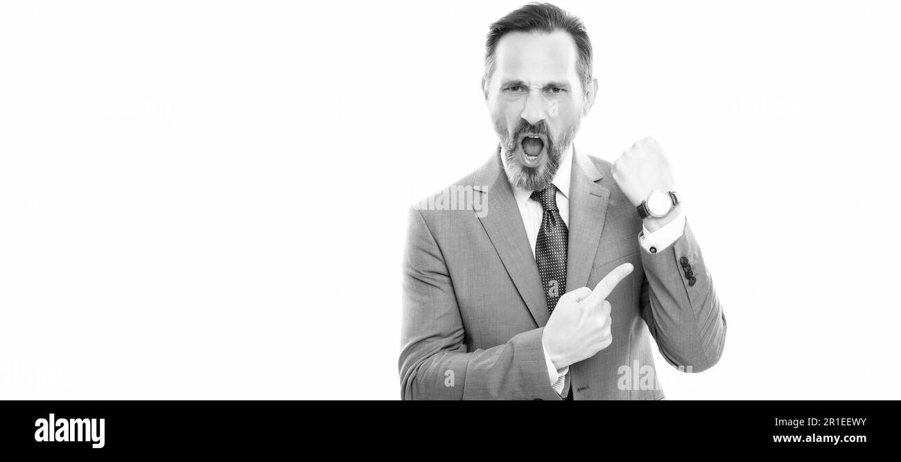 Man face portrait, banner with copy space. angry mature director in suit pointing finger on time on watch isolated on white, late Stock Photo
