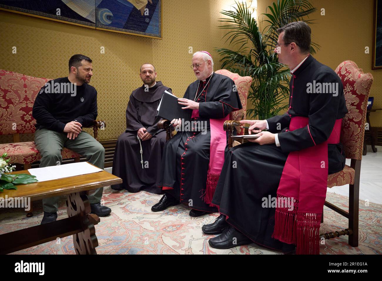 Vatican, Vatican City. 13th May, 2023. Vatican Secretary (2R) for Relations with States Msgr Paul Richard Gallagher meets with Ukrainian President Volodymyr Zelensky (L) at the Studio of Paul VI Hall on Saturday, May 13, 2023 in Vatican City, Vatican. Photo by Ukrainian President Press Office/UPI. Credit: UPI/Alamy Live News Stock Photo