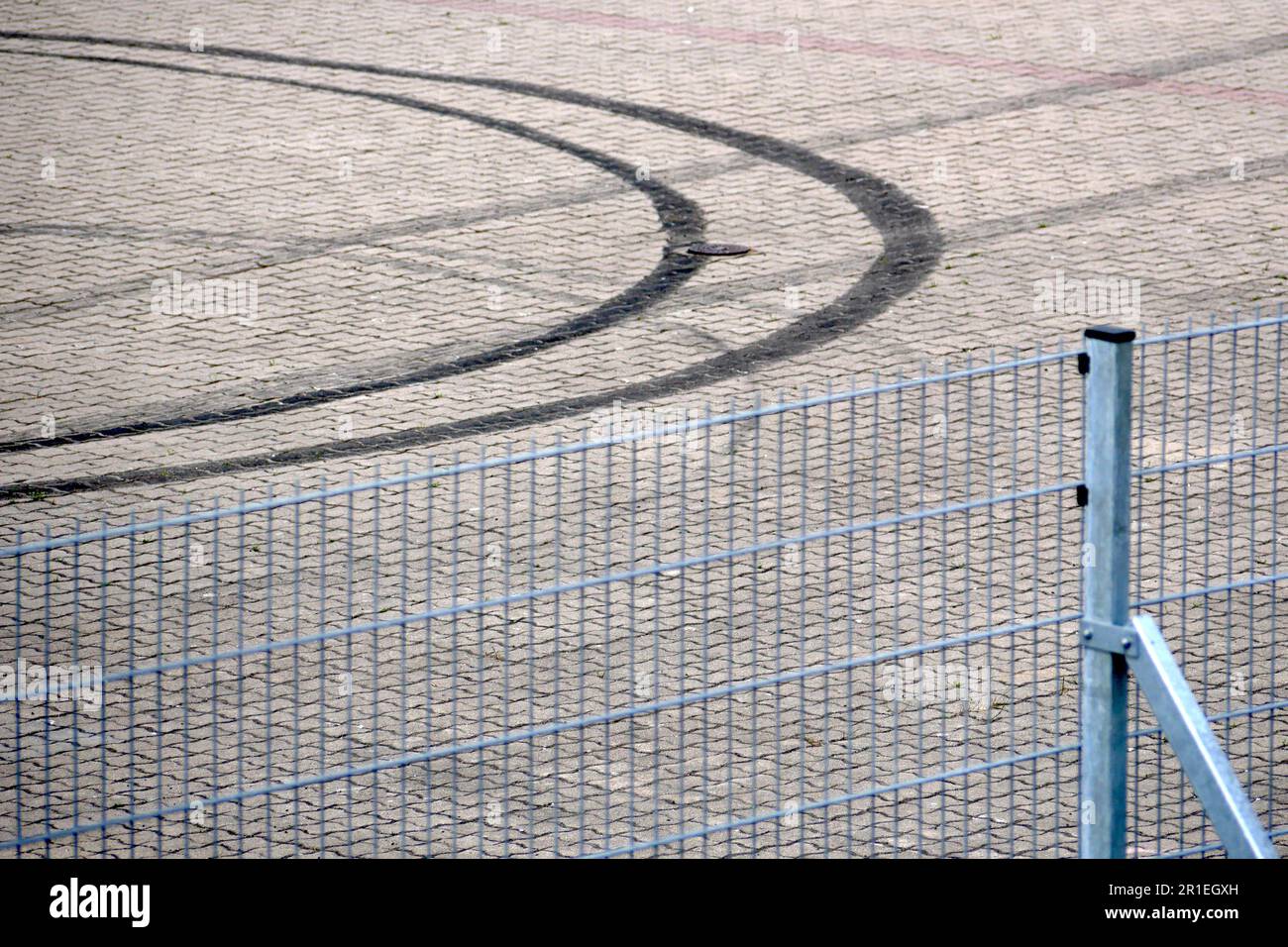 circular car tire skidmark on pavement Stock Photo