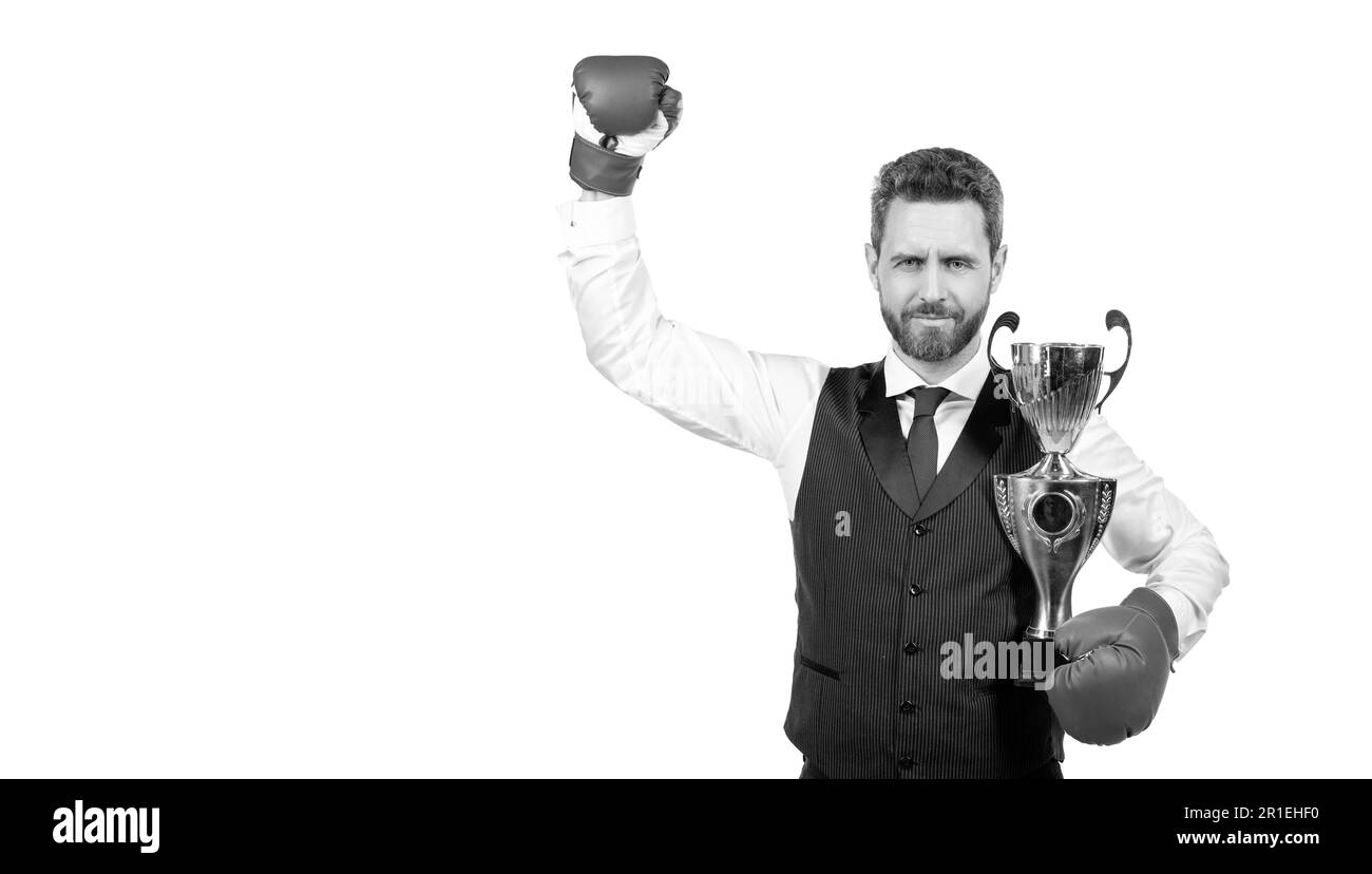 proud man in boxing gloves and suit hold champion cup isolated on white background, copy space, knock out. Stock Photo