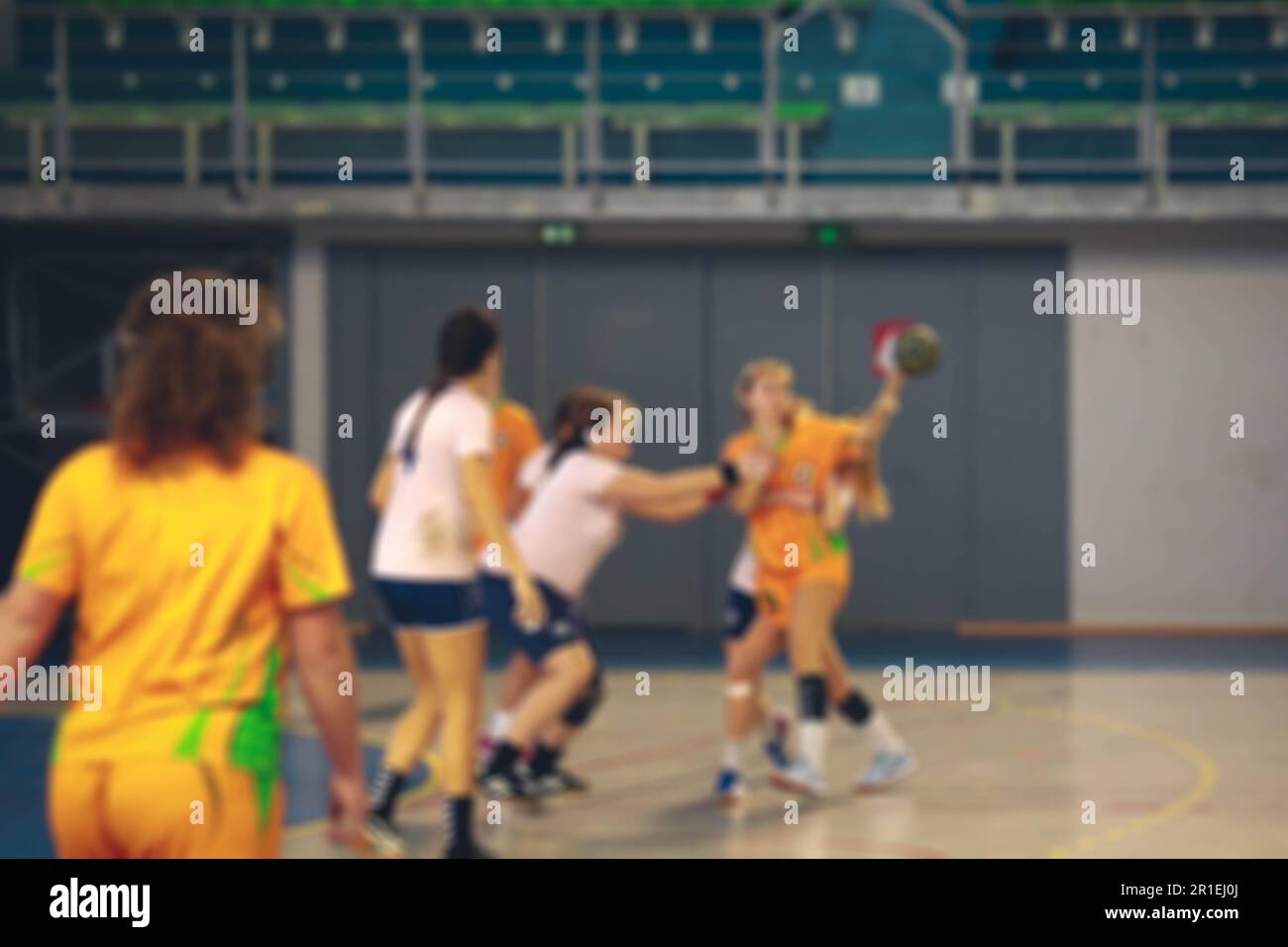 Blurred image of women handball players in action Stock Photo
